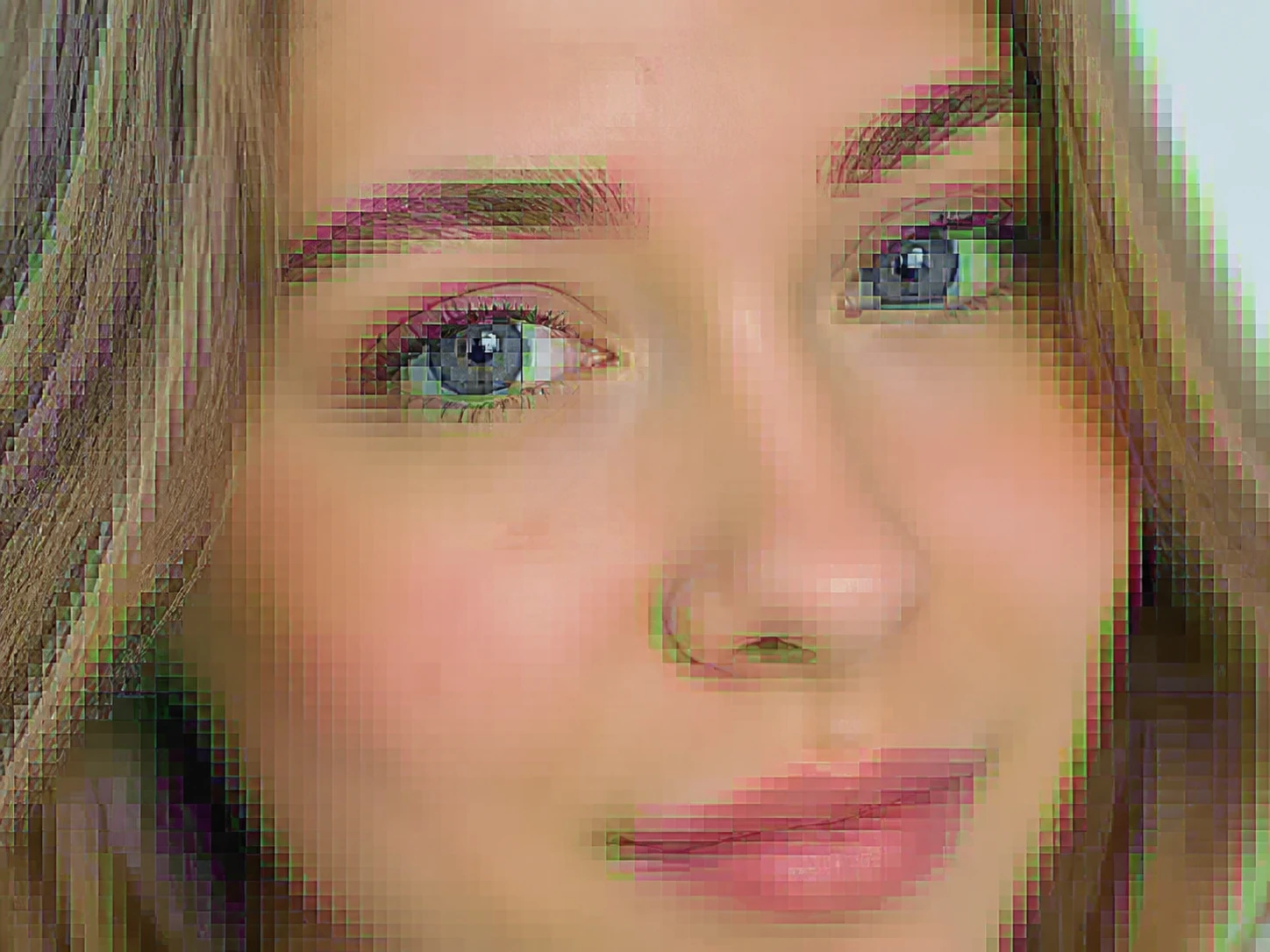 A forwarded face showing square blocking and dirty color fringes across flat skin, not soft blur
